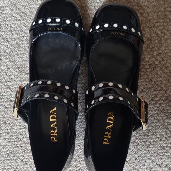 Prada Glossy Black Flats with Gold Buckle and White Accents